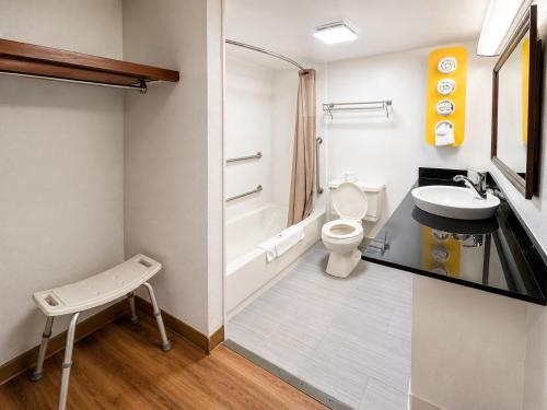 a bathroom with a toilet and a sink at Motel 6-New Stanton, PA in New Stanton