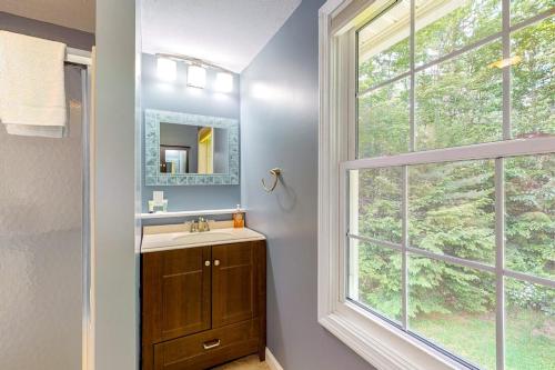 a bathroom with a sink and a window at RiverHouse in Ogunquit