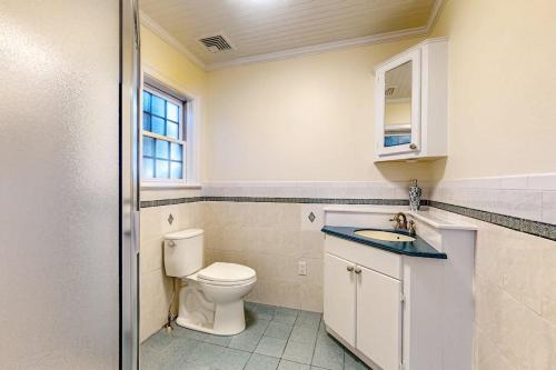 a bathroom with a toilet and a sink at Bianca in Gloucester