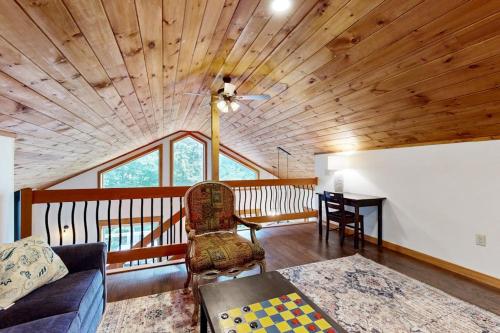 a living room with a couch and a table at Ferncrest Mountain House in Conway