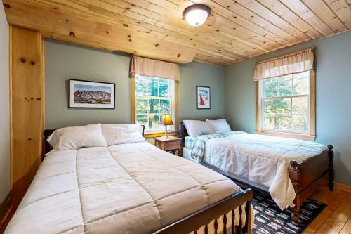 a bedroom with two beds and a window at Bethel Peak Escape in Bethel