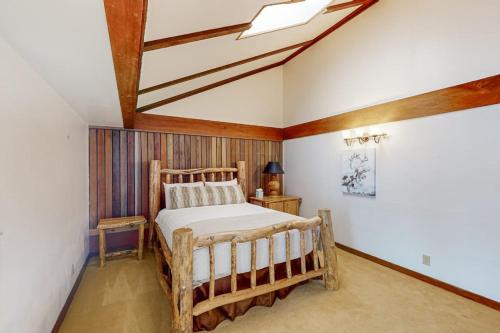 a bedroom with a wooden bed in a room at Wister C in Teton Village