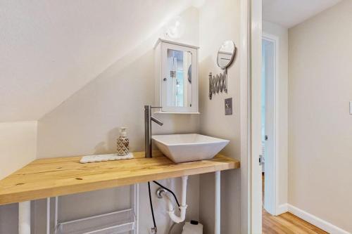 a bathroom with a white sink on a counter at Willow Cove in York