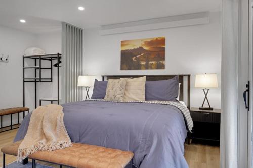 a bedroom with a large bed and two lamps at Spruces 11 in Wilson