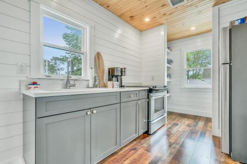 a kitchen with a sink and a stove at Salt & Petal in Old Orchard Beach