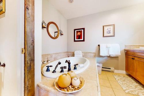 a bathroom with a tub and a sink at Crown Mountain Retreat in Carbondale