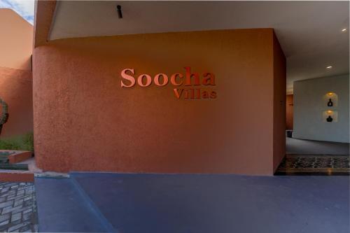 a building with a sign that reads scotia villas at Soocha Villas in Yogyakarta