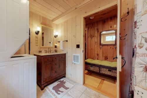 a bathroom with a sink and a vanity with a mirror at Brandy Shores in Naples