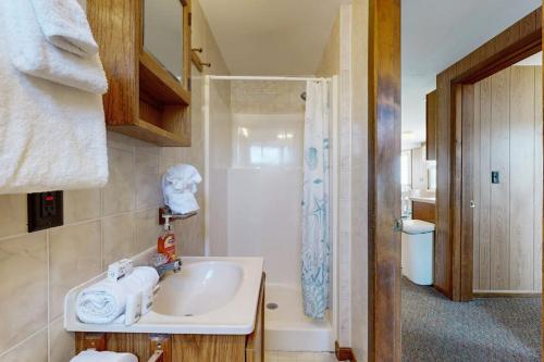 a bathroom with a sink and a shower at Seaglass Cottage in York