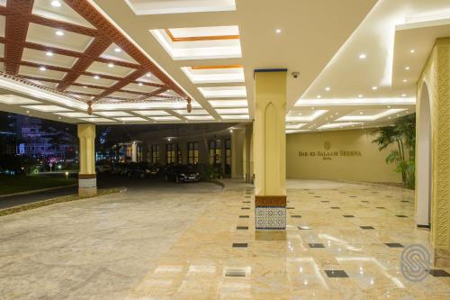 an empty lobby of a building with columns and ceilings at Dar es Salaam Serena Hotel in Dar es Salaam