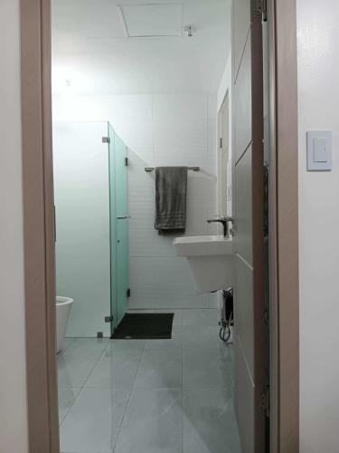 a white bathroom with a sink and a toilet at California style Resident in Iloilo City