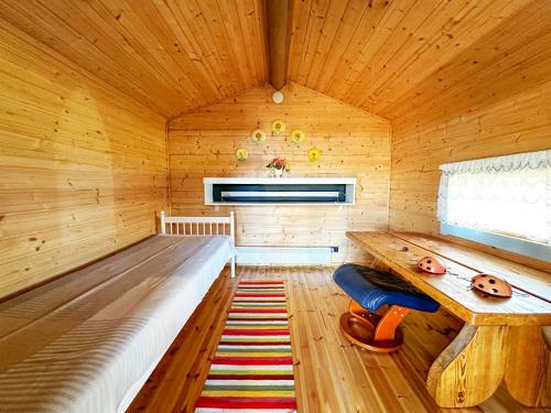 a large wooden room with a bed in a sauna at Villa Laura in Savonlinna