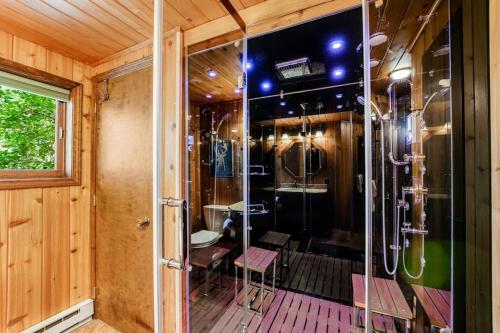 a bathroom with a shower in a room at Log Cabin Lookout in Bigfork