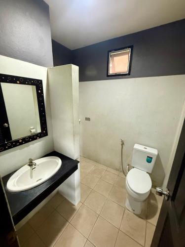 a bathroom with a white toilet and a sink at KT Garden Villa in Ko Samui