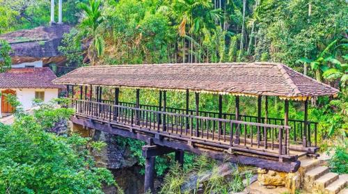 a bridge with a roof on top of a mountain at Beyond ella in Ella
