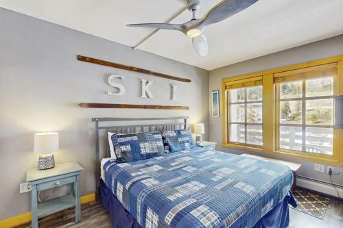 a bedroom with a bed and a ceiling fan at Passage Point 422 in Copper Mountain