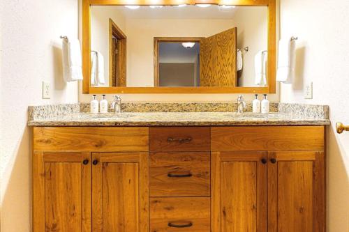 a bathroom with a sink and a mirror at Timber Ridge 4 in Teton Village