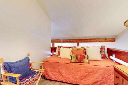 a bedroom with a bed and a chair at 3622 Winterberry in Wilson