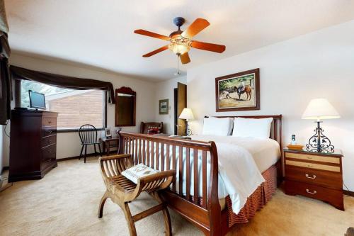 a bedroom with a bed and a ceiling fan at Granite A in Jackson