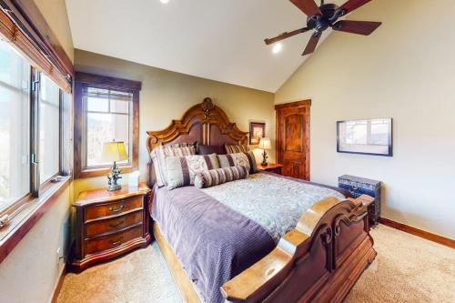 a bedroom with a large bed and a ceiling fan at Buffalo Lodge Townhomes 1293 in Silverthorne