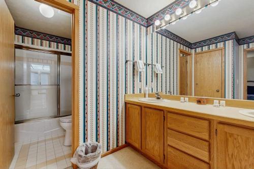 a bathroom with a sink and a toilet at Park 282 in Big Sky