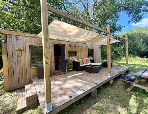 a wooden deck with a tent on top of it at Nesta's Nook in Llandovery