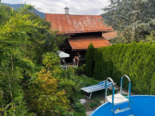 a view of a house with a bench in the yard at Patzberg Liesl in Dorfgastein