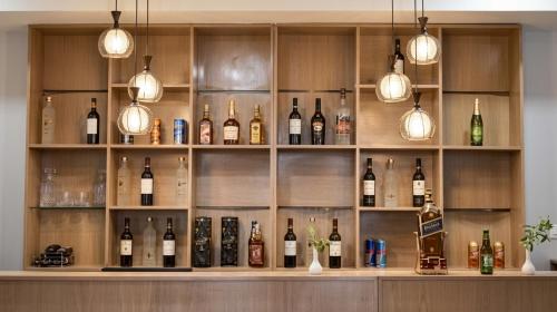 a bar with lots of bottles of wine at GaYuel in Thimphu