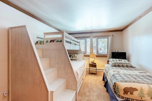 a bedroom with a bunk bed and a staircase at Mountainback 47 in Mammoth Lakes