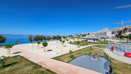 a view of a park with people riding a bike at Apartments Deja Views - Žnjan beach in Split