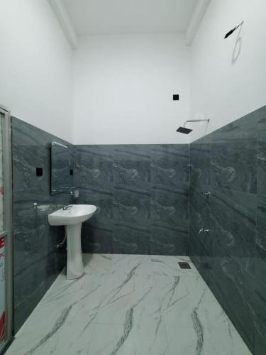 a bathroom with a sink and a mirror at River Nature Park in Polonnaruwa