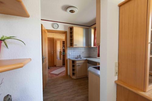 a small kitchen with a sink and a counter at Ferienhaus Bergblick in Redlham