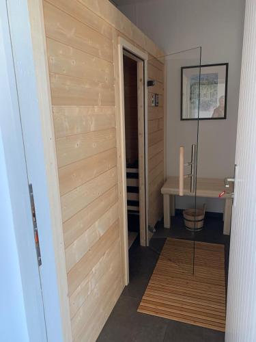 a room with a wooden door and a table at Chalet im Chiemgau in Siegsdorf