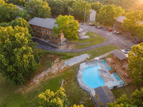 an aerial view of a building with a swimming pool at Ozark Skyline Retreat in Branson West