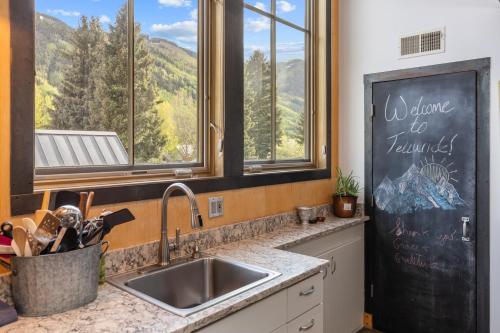 a kitchen with a sink and a window at Galena Chalet - Valley View 1 Br 1 Ba 2 Half Ba Sleeps 4 in Telluride