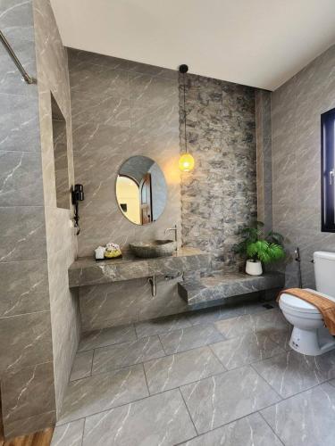 a bathroom with a sink and a mirror at baankorrakang in Bangkok Noi