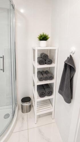 a white shelf in a bathroom with a shower at Torrevieja - La Mata Beach First Line New Apartments 2024r in La Mata
