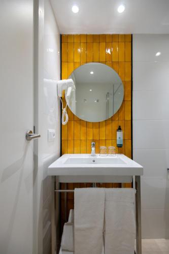 a bathroom with a sink and a mirror at Hotel Foners in Playa de Palma