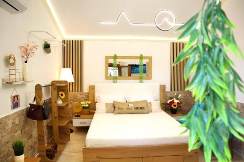 a bedroom with a bed and a mirror at Thassion-ikea Feels Like Home in Astris