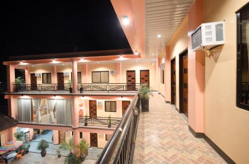 an empty hallway of a building with a balcony at RSG Microhotel in General Santos