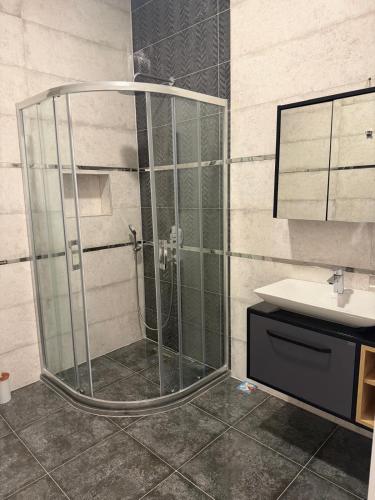 a shower with a glass door in a bathroom at Villa Lost dalaman in Çakallık