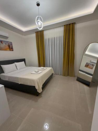 a hotel room with a bed and a window at Villa Lost dalaman in Çakallık