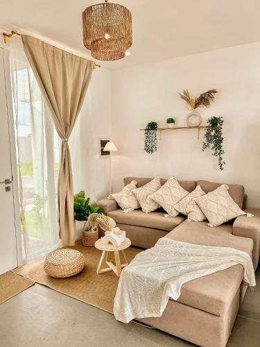 a living room with a couch and a table at South Haven in Calo