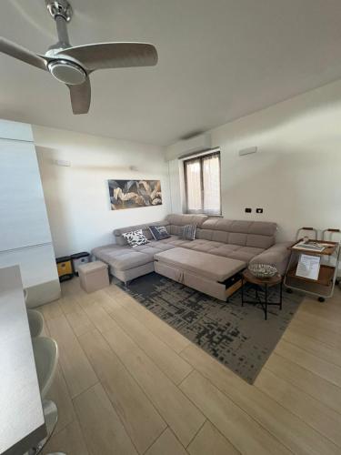 a living room with a couch and a table at La casa di Gio' Lake Maggiore Near Leonardo in Dormelletto