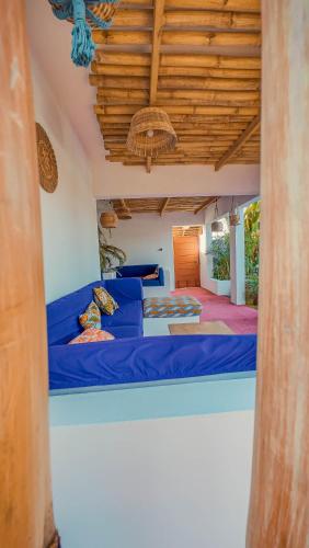 a bedroom with a blue bed in a room at VILLA Fleurie in Mafia