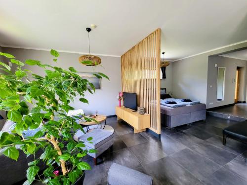 a living room with a couch and a table at Heideberg Appartement in Zeuthen