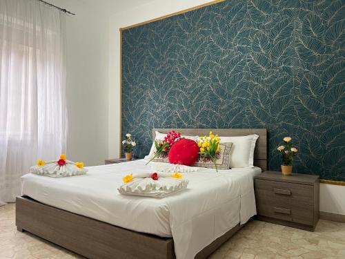 a bedroom with a large bed with flowers on it at Ca dei Cappuccina in Mestre
