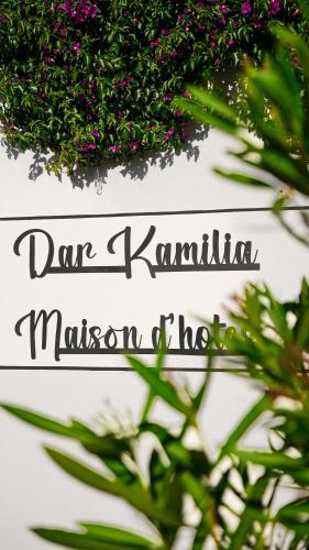 a sign that says dave kantiniancussioncussioncussioncussioncussioncussionociation at Maison d'hôtes Kamilia in Ksar es Sghir