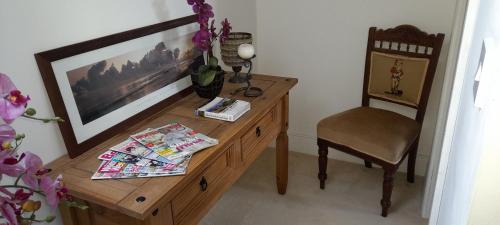 a room with a wooden desk and a chair at Double Bed in Loft Space with En Suite in Loughrea