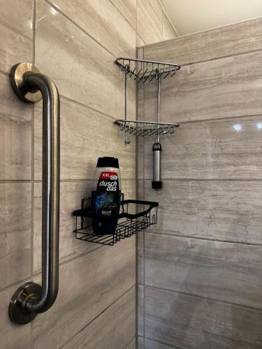 a bathroom with a soap dispenser on the wall at Fewo Helene im Haus Moselwelt in Zell an der Mosel